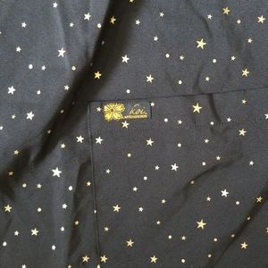 Women's scrub top black worh gold stars